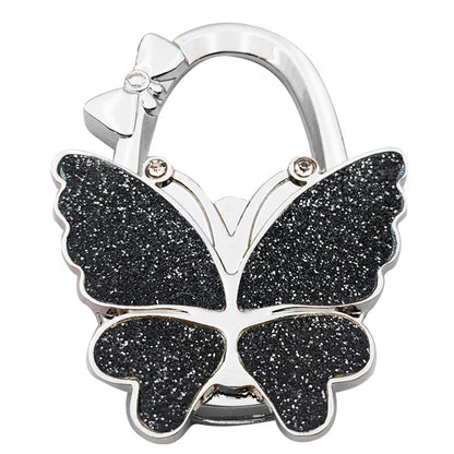 Butterfly Foldable Handbag Hook – Stylish, Portable & Non-Slip Bag Hanger